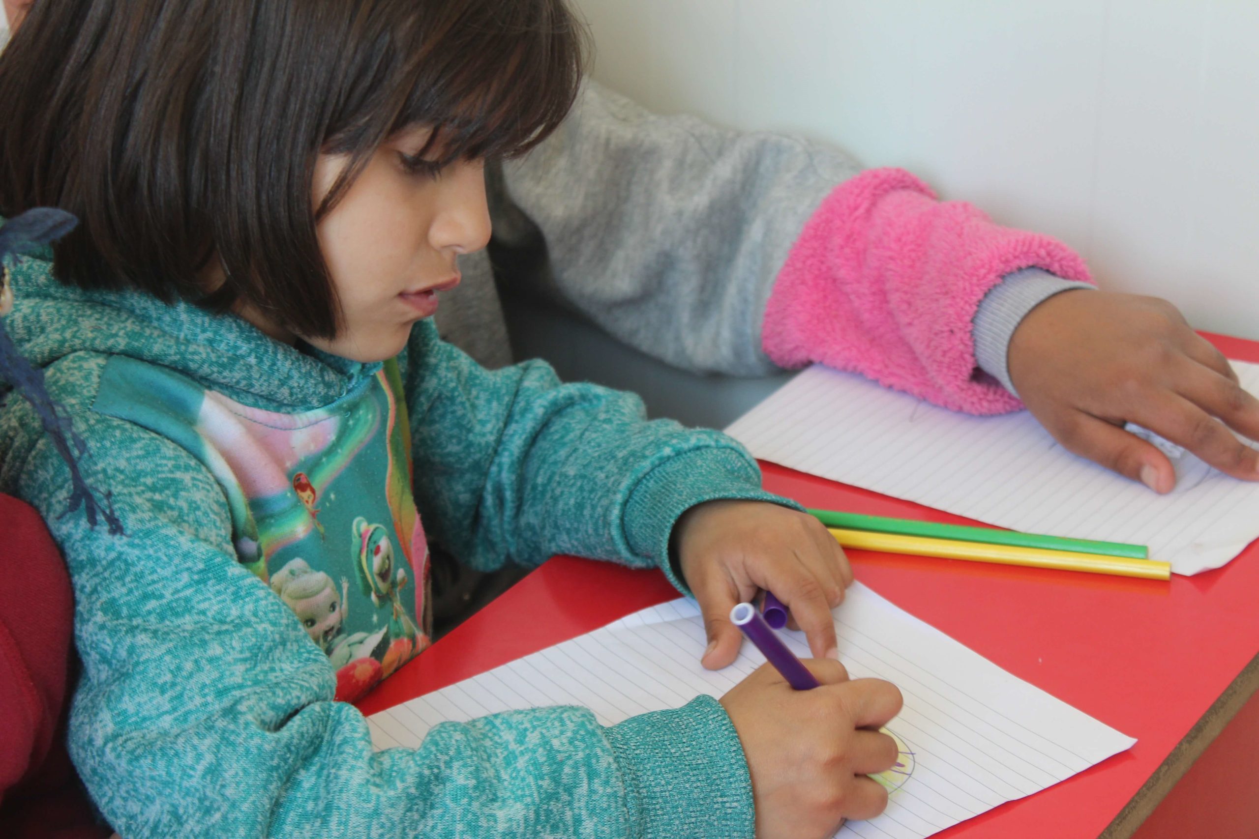 Back to school - The child is using the school supplies.